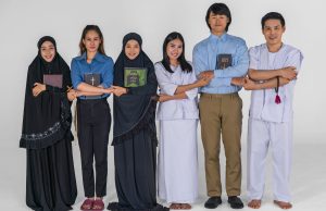 portrait of multicultural group of diverse religious asian people Christian Buddhist and muslim posing together showing inclusive teamwork and cooperation